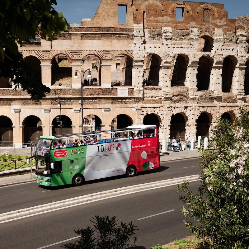 Tourist bus in front of the Colosseum